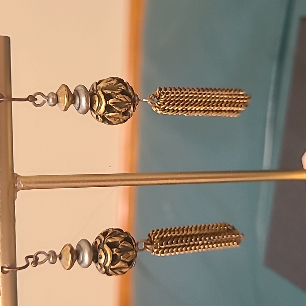 Pierced Earrings in gold and black beads with gold tassles.